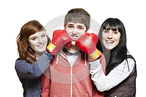 Teenage siblings fighting with boxing gloves