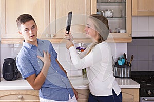 Teenage siblings having fight in kitchen