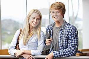 Teenage student girl and boy indoors