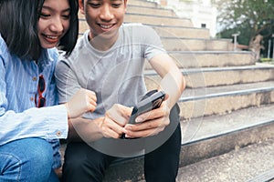 Teenage student using digital mobile phone