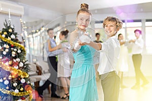 Teenage students rehearsing ballroom dance number for upcoming Christmas party