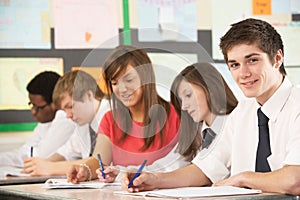 Teenage Students Studying In Classroom