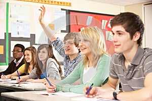 Teenage Students Studying In Classroom