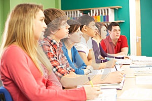 Teenage Students Studying In Classroom