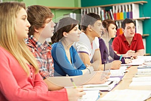 Teenage Students Studying In Classroom