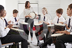 Teenage Students Studying Percussion In Music Class