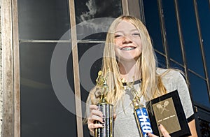 Teenage Tennis Player with Trophies