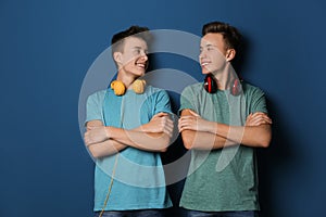 Teenage twin brothers with headphones