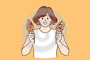 Teenage woman holds two ice creams with fruit syrup and waffle cone and looks at screen smiling