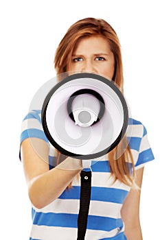 Teenage woman screaming through megaphone