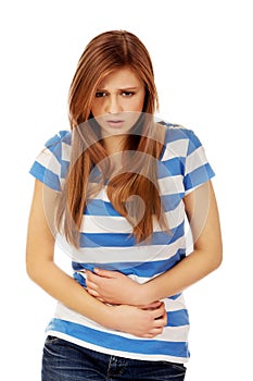 Teenage woman with stomach ache