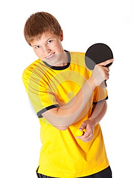 Teenage in yellow T-shirt playing ping pong
