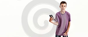 Teenaged disabled boy with cerebral palsy looking at camera and holding smartphone, posing isolated over white