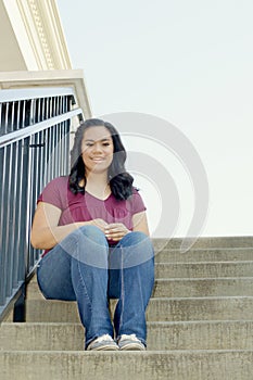 Teen Girl Sitting on Stairway