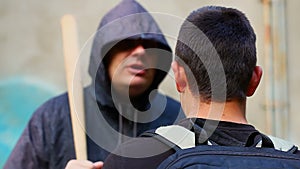 Teenager against aggressive man with a baseball bat