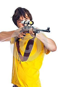 Teenager aiming a rifle