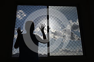 Teenager at the apartment window