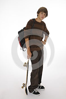 Teenager with backpack and skateboard