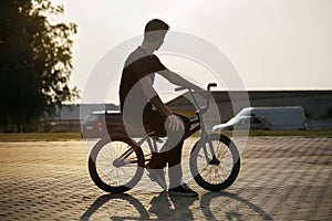 Teenager on a bicycle