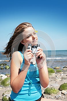 Teenager with binocular photo
