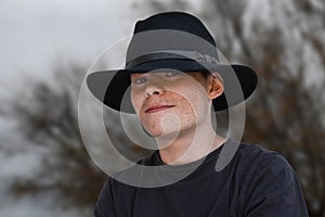 Teenager with black hat