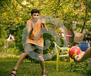 Teenager boy with ball close up photo playing football