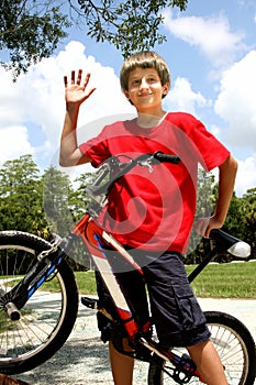 Teenager boy with bicycle