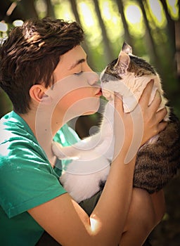Teenager boy with cat