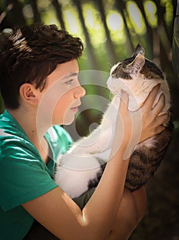 Teenager boy with cat