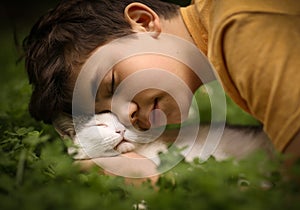 Teenager boy with cat in hummock nap