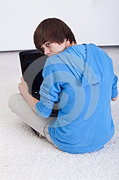 Teenager boy caught surfing the web