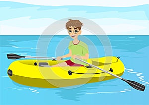 Teenager boy with glasses in yellow rubber boat