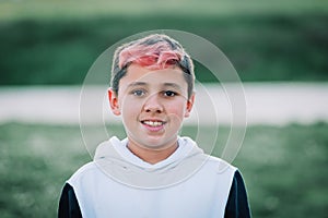 Teenager boy with hair painted red