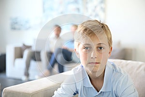 Teenager boy sitting at home