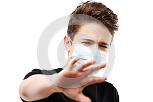 Teenager boy wearing respiratory protective medical mask