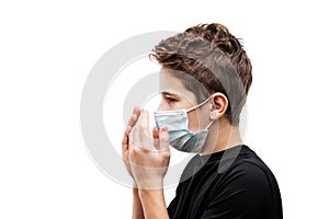 Teenager boy wearing respiratory protective medical mask