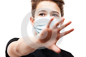 Teenager boy wearing respiratory protective medical mask