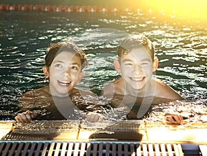 Teenager boys in open air swimming pool