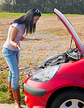 Teenager with broken down car