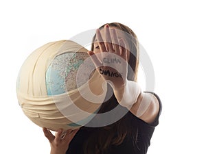 Teenager caucasian girl holding ill planet - Earth globe in bandage . Climate change