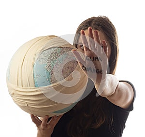 Teenager caucasian girl holding ill planet - Earth globe in bandage . Climate change