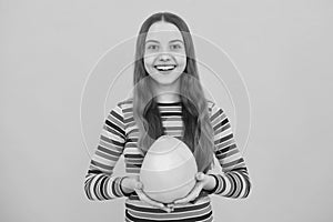 Teenager child girl hold citrus fruit pummelo or pomelo full of vitamin. Kid healthy eating.