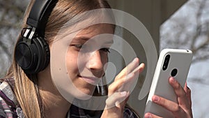 Teenager Child Playing Smartphone in Park, Adolescent Kid Browsing Internet Young Girl Listening Music on Headphones Smart Phone