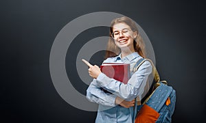 Teenager in class on background of blackboard