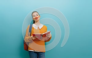 teenager on color paper wall background