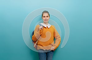 teenager on color paper wall background