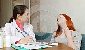 Teenager complaining to doctor about symptoms