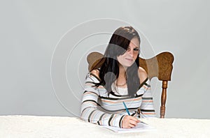 Teenager completing form