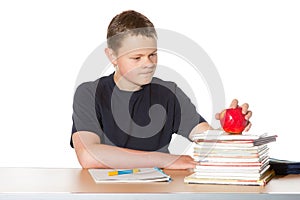 Teenager contemplating a ripe red apple