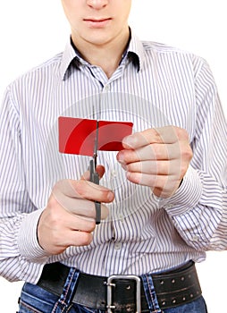 Teenager cutting a Credit Card
